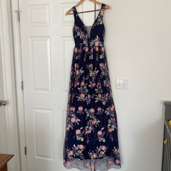 GB formal gown in navy with embroidered pink, yellow, and blue flowers. - Picture 1 of 15